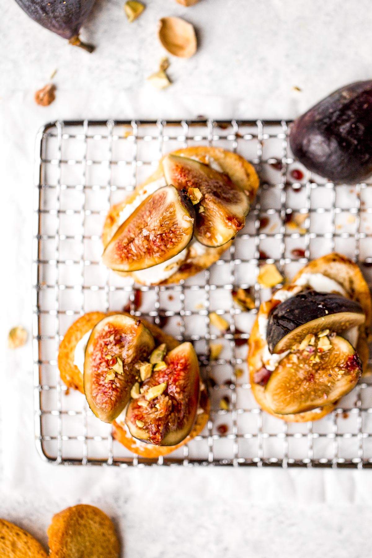 Fig crostini topped sweet, juicy figs, tangy goat cheese and crunchy pistachios is flavourful, delicious, and perfect for snacking on or entertaining. | aheadofthyme.com