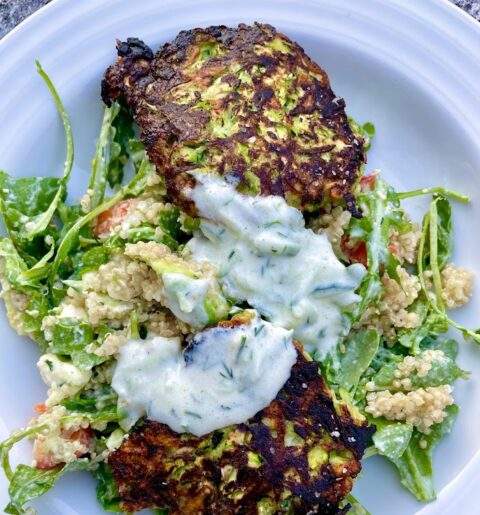 Zucchini Fritters with Tzatziki over Greek Salad with Quinoa and Feta