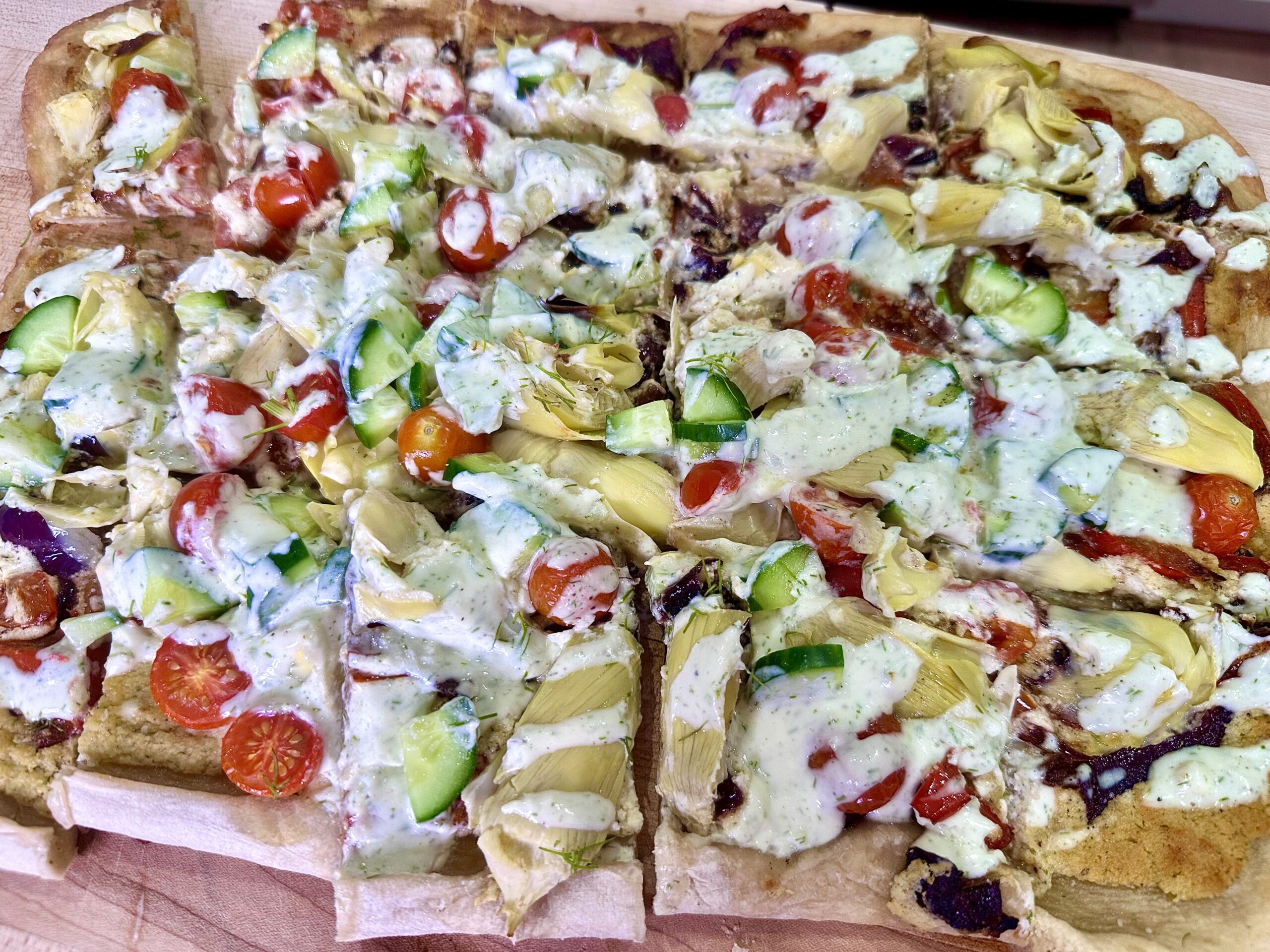 Loaded Greek Pizza with Whipped Feta and Tzatziki Drizzle
